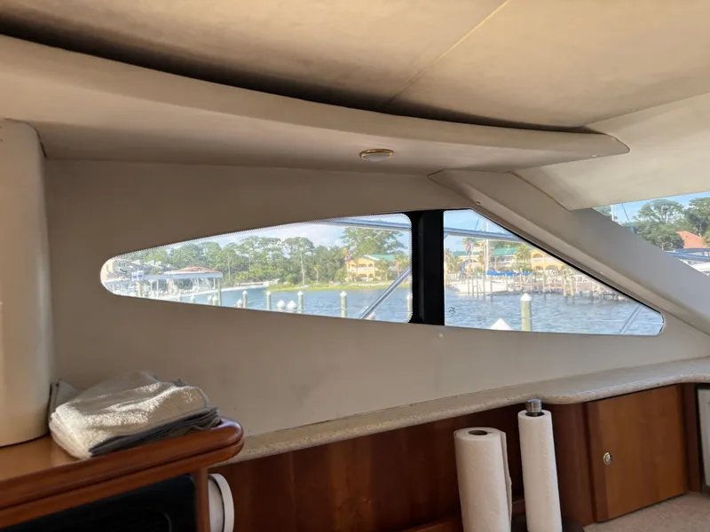 Slide: The Image of 2001 Silverton 410 Sport Bridge kitchen with microwave, sink, and kettle. - 17