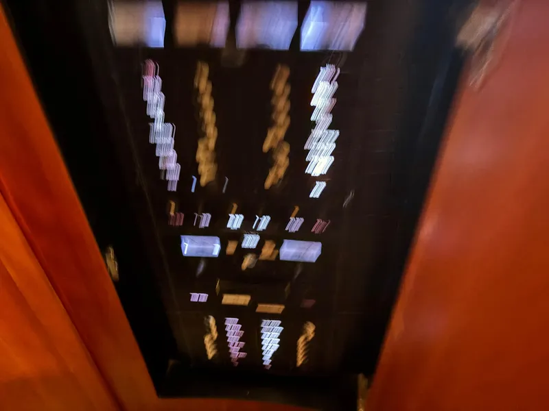 Slide: The Image of Interior view of 2001 Silverton 410 Sport Bridge yacht with marina scenery through window. - 19