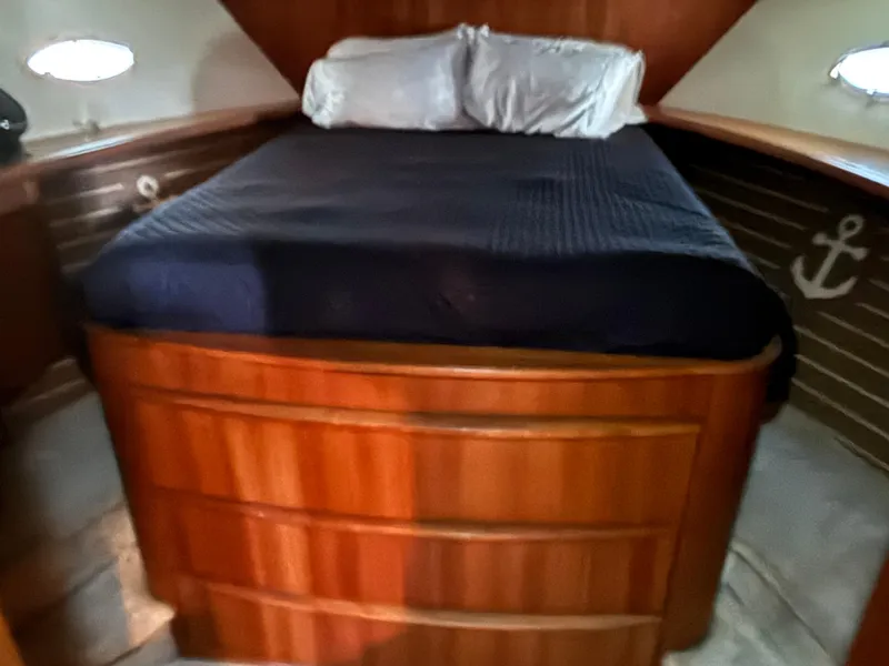 Slide: The Image of Engine compartment of a 2001 Silverton 410 Sport Bridge with red engine components. - 26