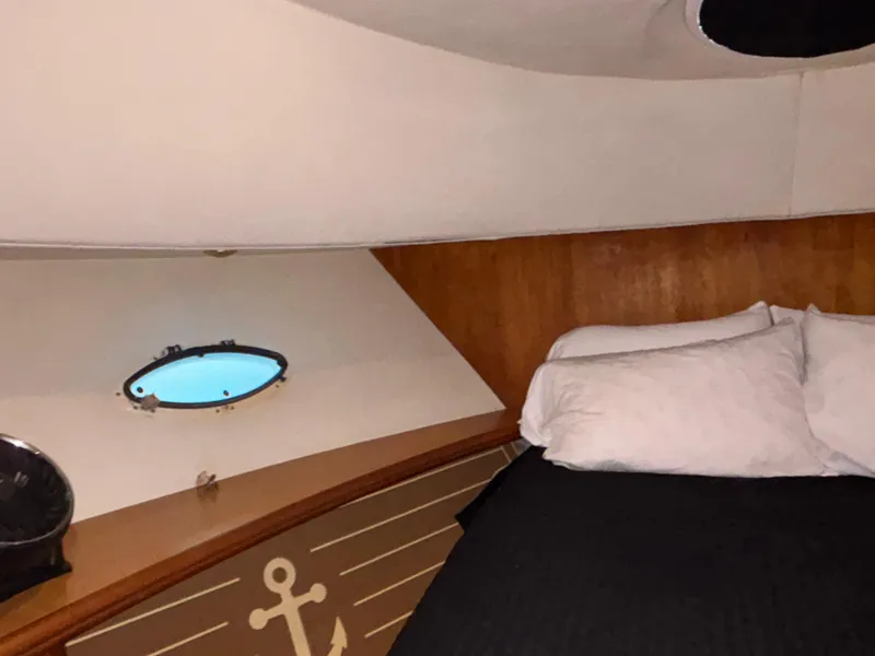 Slide: The Image of Engine of a 2001 Silverton 410 Sport Bridge yacht, featuring detailed components and filters. - 27