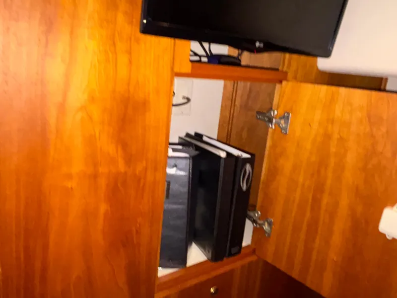 Slide: The Image of Interior cabin of 2001 Silverton 410 Sport Bridge with bed and pillows. - 32