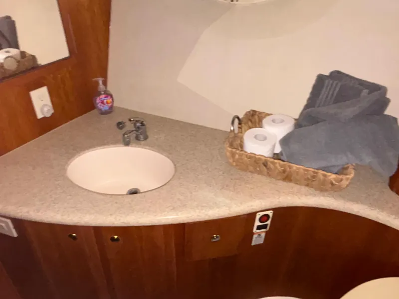 Slide: The Image of Interior cabin of 2001 Silverton 410 Sport Bridge with bed and pillows. - 33