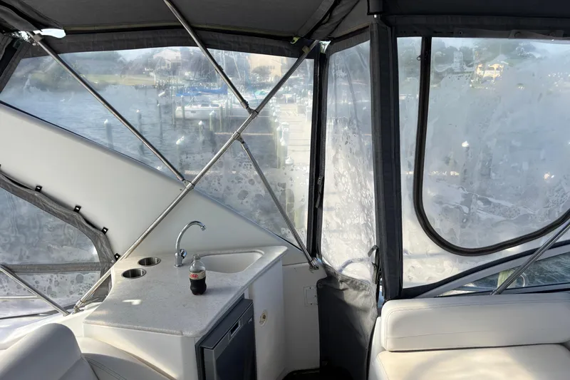 Slide: The Image of 2001 Silverton 410 Sport Bridge interior with sink and marina view. - 45
