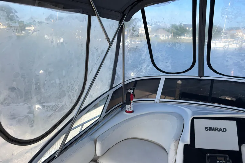 Slide: The Image of Interior view of 2001 Silverton 410 Sport Bridge with Simrad equipment and fire extinguisher. - 46