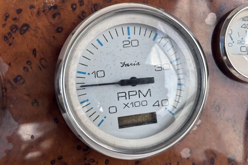 Slide: The Image of Close-up of RPM gauge on 2001 Silverton 410 Sport Bridge boat dashboard. - 49