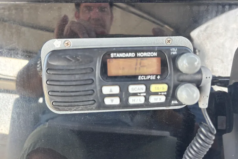 Slide: The Image of Standard Horizon Eclipse+ radio on 2001 Silverton 410 Sport Bridge boat dashboard. - 52