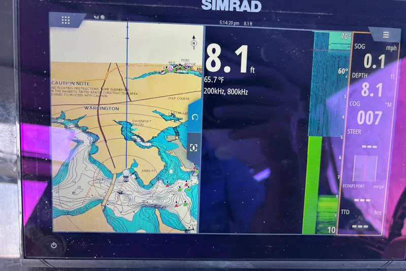Slide: The Image of Simrad marine navigation display on 2001 Silverton 410 Sport Bridge, showing depth and map. - 55