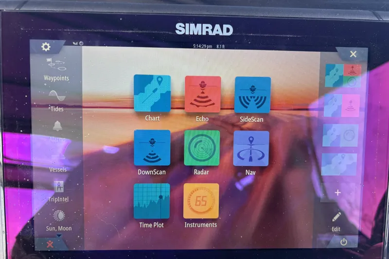 Slide: The Image of Simrad marine navigation display on 2001 Silverton 410 Sport Bridge, showing various sonar and radar options. - 56