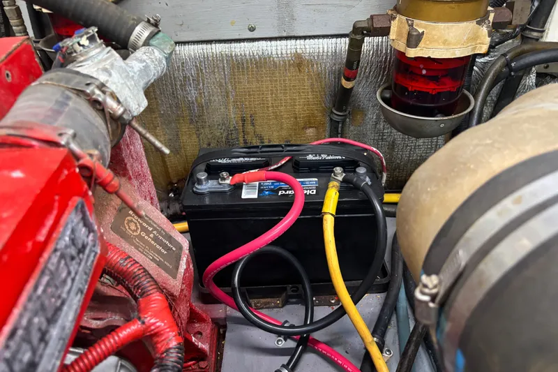 Slide: The Image of Engine compartment of 2001 Silverton 410 Sport Bridge with battery and wiring. - 77