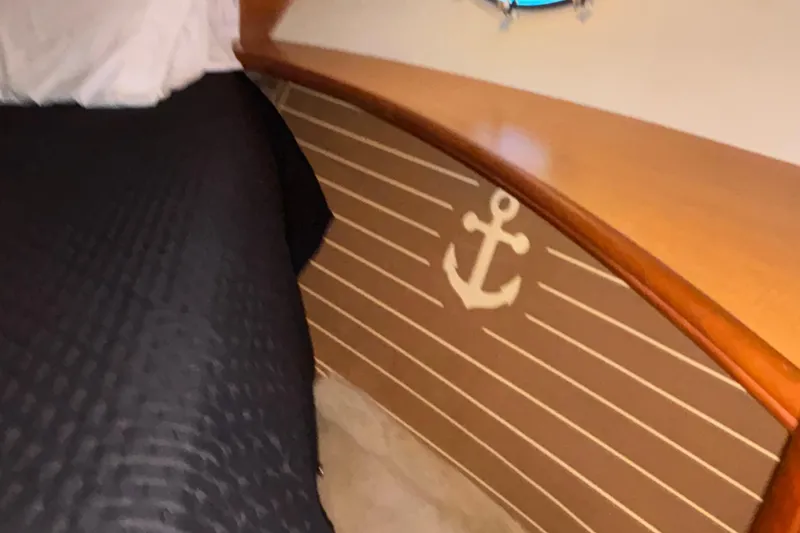 Slide: The Image of Interior of 2001 Silverton 410 Sport Bridge with anchor decor and wooden accents. - 85