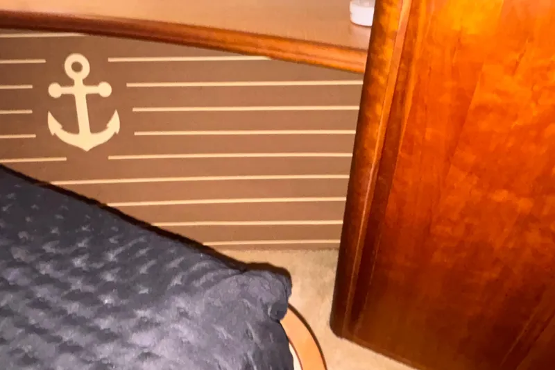 Slide: The Image of Interior of 2001 Silverton 410 Sport Bridge with anchor decor and wooden finish. - 86