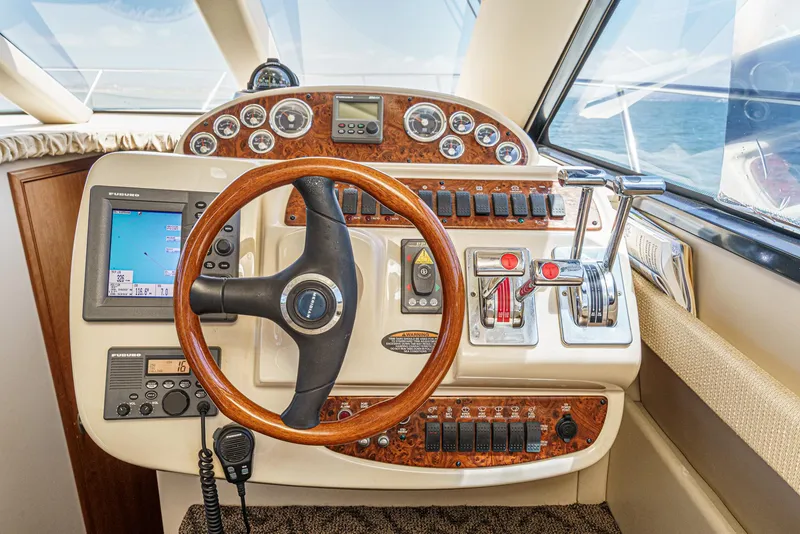 Slide: The Image of Cockpit of 2003 Meridian 341 Sedan with steering wheel and navigation controls. - 11