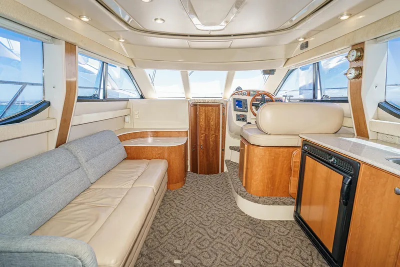 Slide: The Image of Luxurious interior of a 2003 Meridian 341 Sedan yacht with plush seating and modern amenities. - 24
