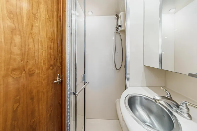 Slide: The Image of Bathroom interior of 2003 Meridian 341 Sedan yacht with shower and sink. - 27