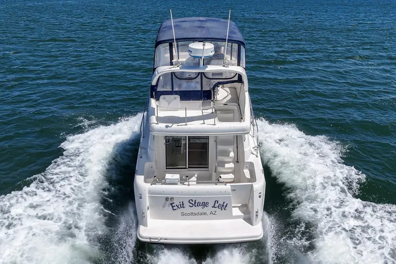 Slide: The Image of 2003 Meridian 341 Sedan cruising on open water, rear view. - 3