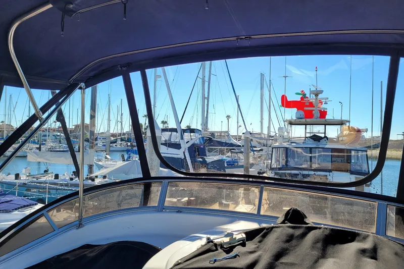 Slide: The Image of View from a 2003 Meridian 341 Sedan yacht in a marina with sailboats. - 34