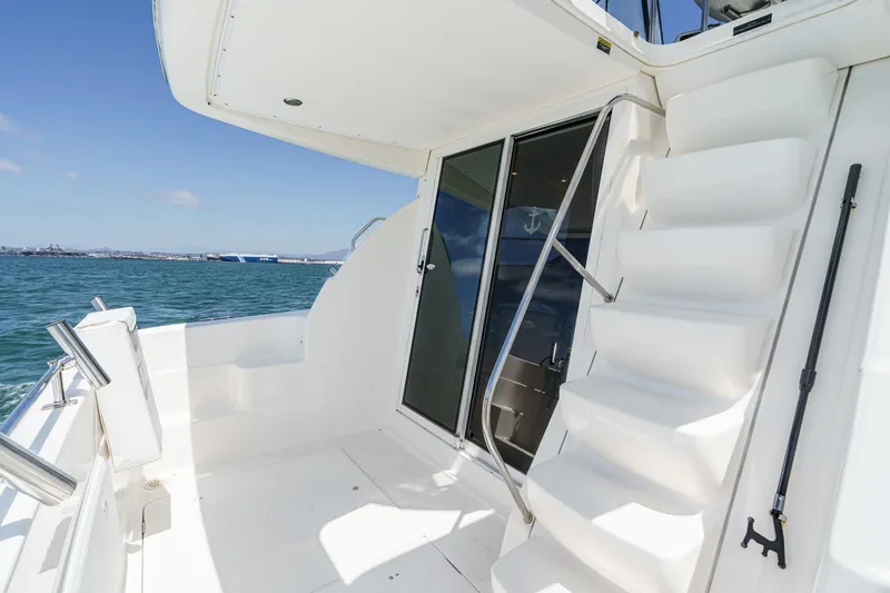 Slide: The Image of 2003 Meridian 341 Sedan yacht deck with stairs and ocean view. - 5