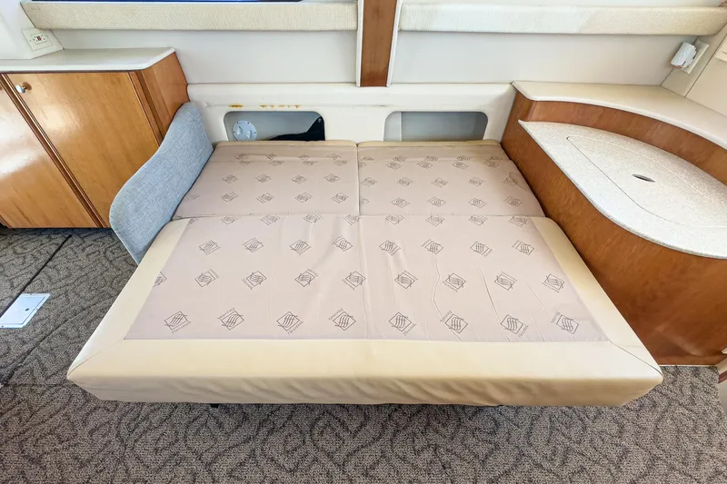 Slide: The Image of 2003 Meridian 341 Sedan interior with convertible bed and wooden cabinetry. - 8