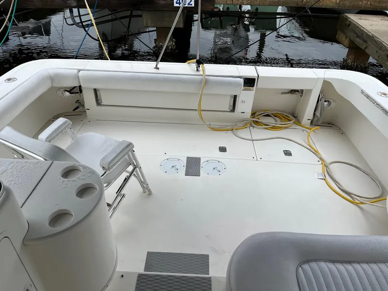 Slide: The Image of 2001 Sea Ray 340 Amberjack boat deck with seating and storage compartments. - 9