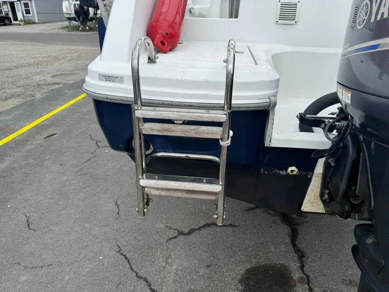 Slide: The Image of 2015 Jeanneau Cap Camarat 6.5 WA boat with ladder and Yamaha engine. - 10