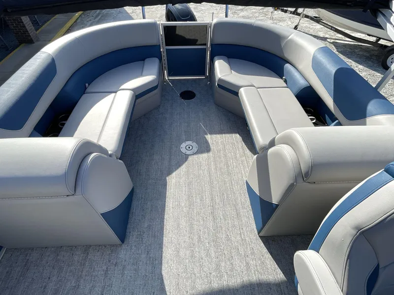 Slide: The Image of 2025 South Bay 224RSLE pontoon boat interior with spacious seating and modern design. - 13