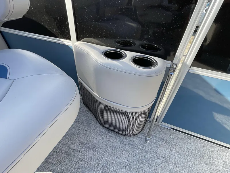 Slide: The Image of 2025 South Bay 224RSLE boat interior with cup holders and seating. - 14