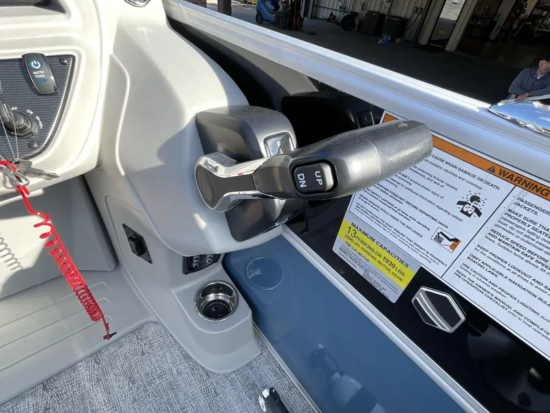 Slide: The Image of 2025 South Bay 224RSLE boat control panel with throttle and safety warnings. - 17