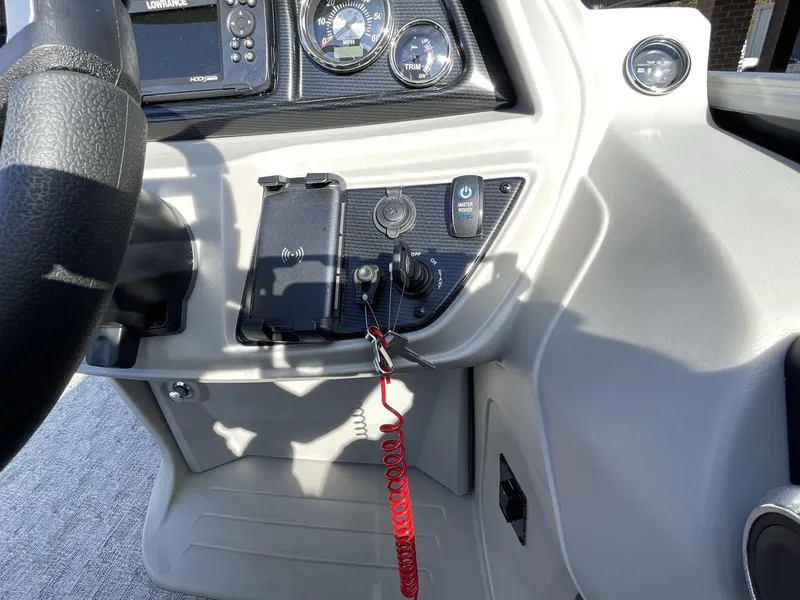 Slide: The Image of Dashboard of 2025 South Bay 224RSLE boat with gauges and controls. - 20
