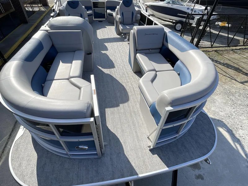 Slide: The Image of 2025 South Bay 224RSLE pontoon boat with spacious seating and modern design. - 24