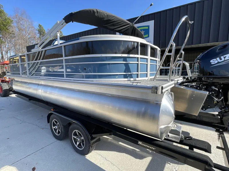 Slide: The Image of 2025 South Bay 224RSLE pontoon boat on trailer, featuring sleek design and modern amenities. - 4