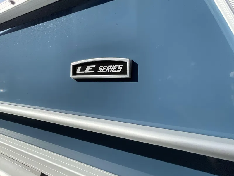 Slide: The Image of 2025 South Bay 224RSLE LE Series boat, blue exterior with sleek design. - 8