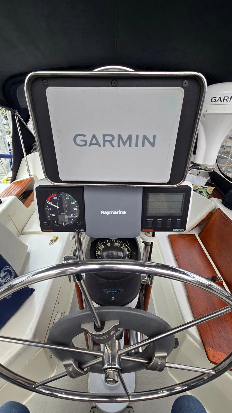 Slide: The Image of Steering wheel and navigation equipment on a 1992 Catalina 30 Tall Rig sailboat. - 11