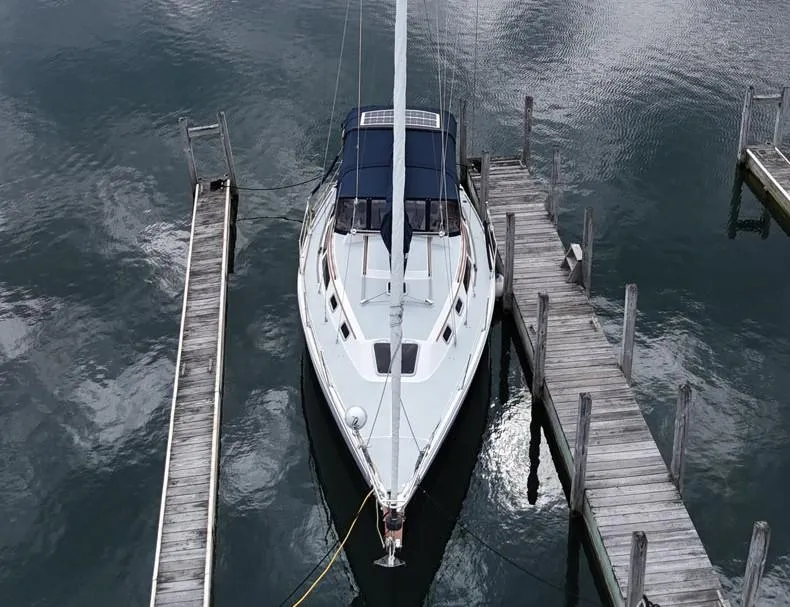 Slide: The Image of Overhead view of a 1992 Catalina 30 Tall Rig sailboat docked at a marina. - 6
