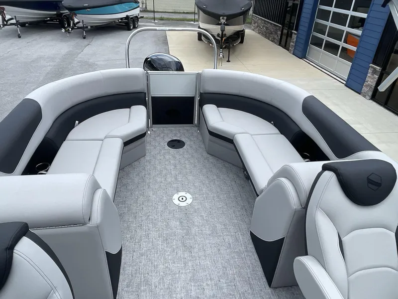 Slide: The Image of 2025 South Bay 224RSLE pontoon boat interior with gray seating and modern design. - 10