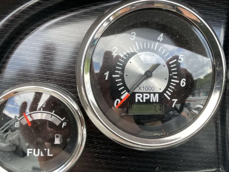 Slide: The Image of Close-up of 2025 South Bay 224RSLE RPM and fuel gauges. - 11
