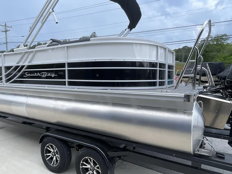 Slide: The Image of 2025 South Bay 224RSLE pontoon boat on trailer, featuring sleek design and modern amenities. - 4
