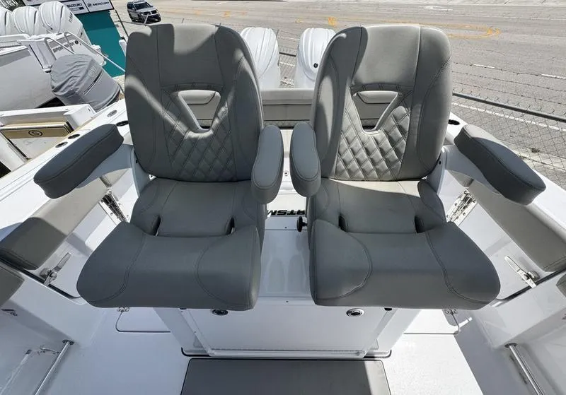 Slide: The Image of Two luxurious gray seats on a 2025 Sportsman Heritage 261 boat. - 15