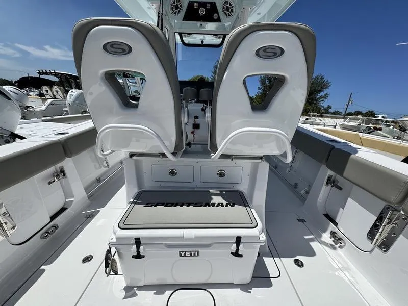 Slide: The Image of 2025 Sportsman Heritage 261 boat interior with Yeti cooler and dual seats. - 21