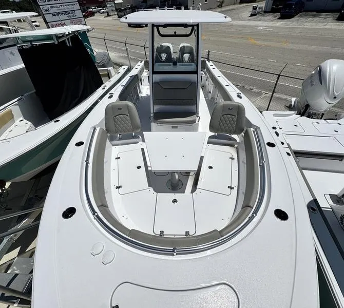 Slide: The Image of 2025 Sportsman Heritage 261 boat with spacious seating and modern design. - 3