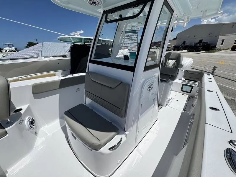 Slide: The Image of 2025 Sportsman Heritage 261 boat interior with seating, console, and modern design features. - 9