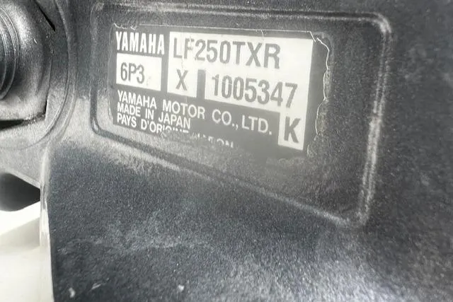 Slide: The Image of Yamaha LF250TXR engine label on 1999 Contender 27 Open Center Console boat. - 13