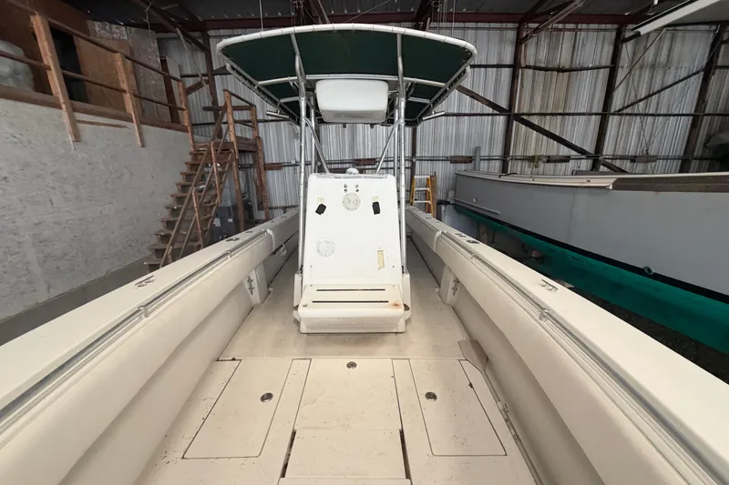 Slide: The Image of Twin Yamaha 250 outboard engines on a 1999 Contender 27 Open CC boat. - 44