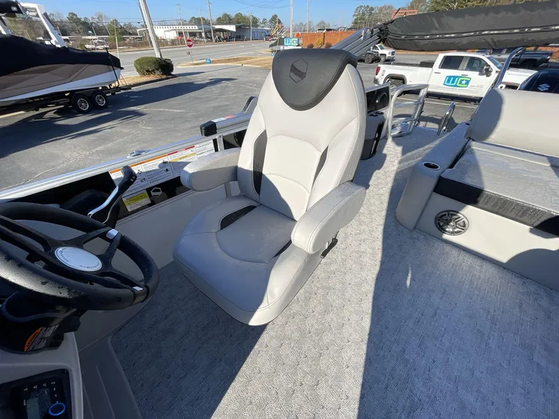 Slide: The Image of Captain's chair on 2025 South Bay 224ULLE pontoon boat, featuring modern design and controls. - 18