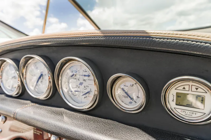 Slide: The Image of Dashboard of 2008 Four Winns F224 boat with gauges and controls. - 12