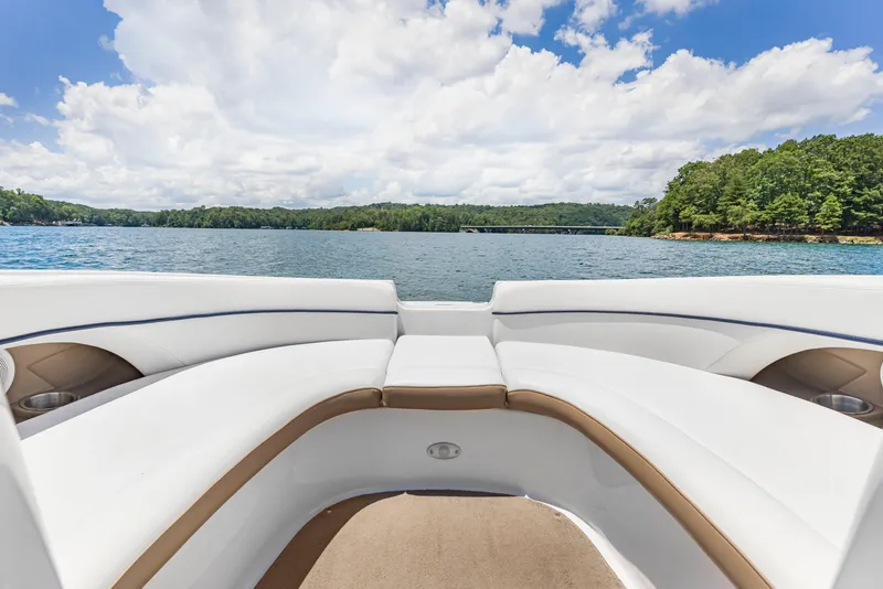 Slide: The Image of 2008 Four Winns F224 boat interior with lake view, clear sky, and lush greenery. - 17