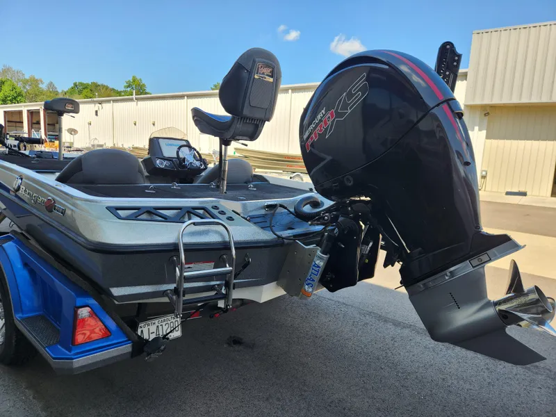 Slide: The Image of 2019 Ranger Z518 boat with Mercury Pro XS engine, parked outdoors. - 4