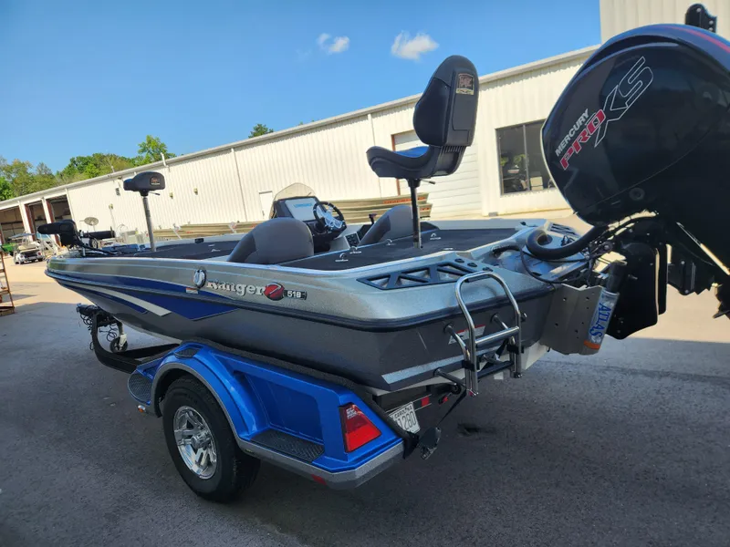 Slide: The Image of 2019 Ranger Z518 boat with Mercury Pro XS engine, parked outdoors. - 5