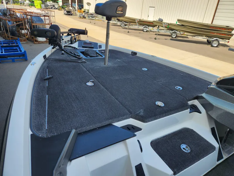Slide: The Image of 2019 Ranger Z518 boat deck with fishing equipment and storage compartments. - 7
