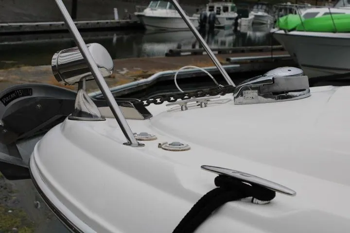 Slide: The Image of 2007 Sea Ray 340 Sundancer boat bow with anchor and cleat at marina. - 11