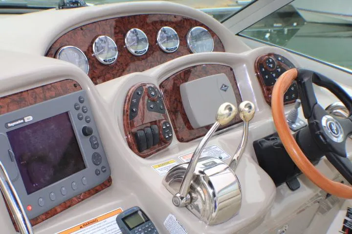 Slide: The Image of Control panel of a 2007 Sea Ray 340 Sundancer boat with gauges and navigation equipment. - 18